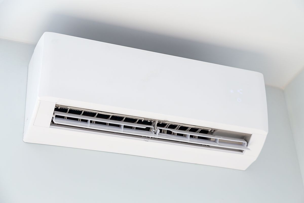 White air conditioner hanging on a wall