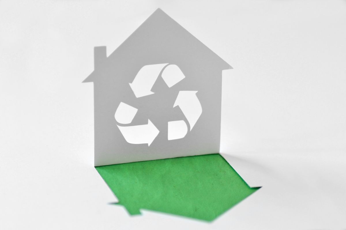 Paper house with recycling symbol - Ecology concept